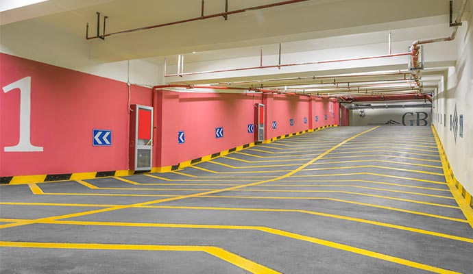 Clean and empty underground parking garage with painted lines