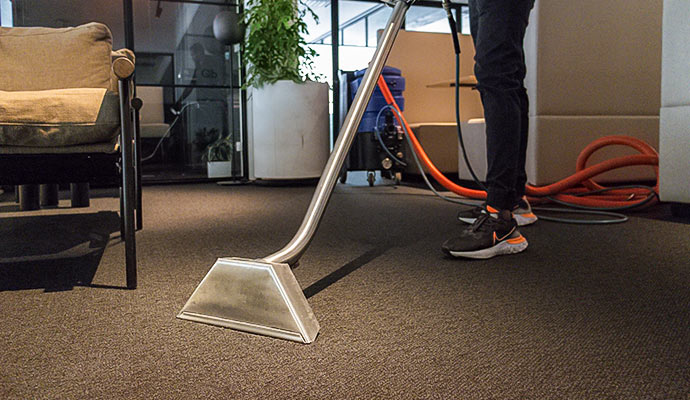 Commercial high-traffic carpet cleaning with a steam wand