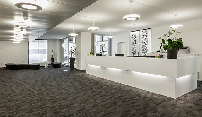 Commercial hotel reception desk with carpet on the floor