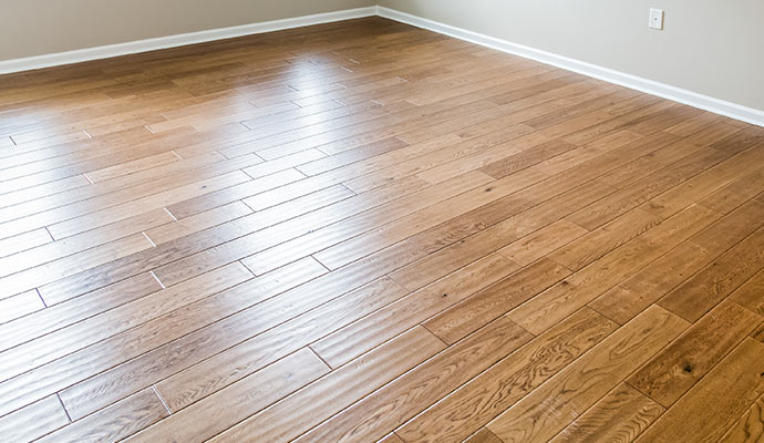 Clean and polished solid hardwood floor planks in a well-lit room