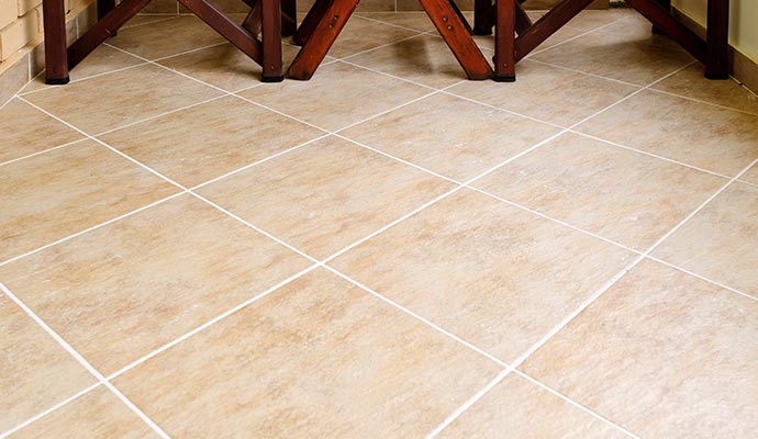 Polished indoor tiled floor showing neat white grout lines and smooth surface