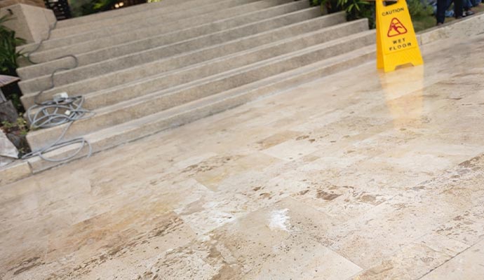 Clean commercial marble flooring surface near stairway inside modern building interior