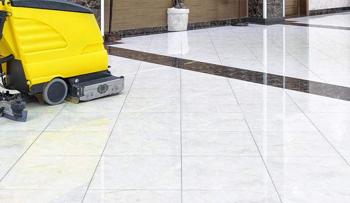 Machine cleaning dirt from tile floor