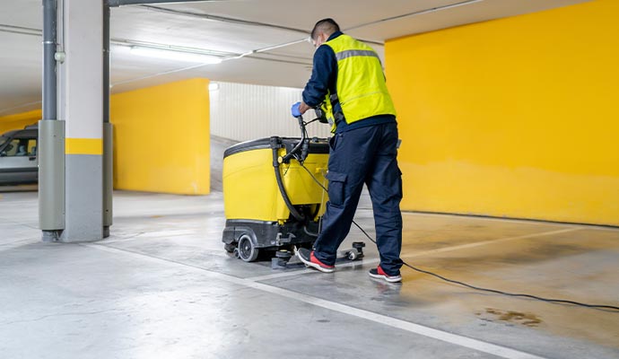 Professional cleaning floor using a scrubber
