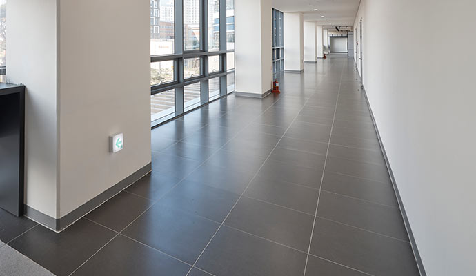 Unglazed tile floor in an office lobby