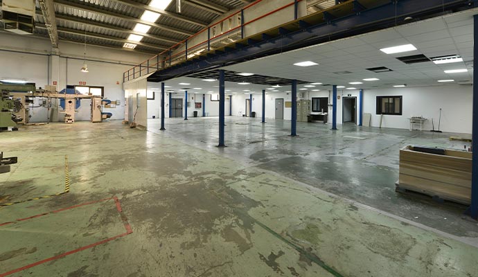 Warehouse floor with worn-out and faded surface