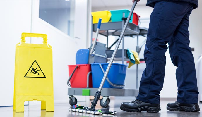 Janitor mopping commercial floor