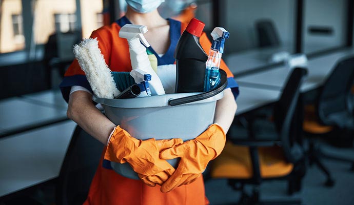Janitorial supplies in a persons hand