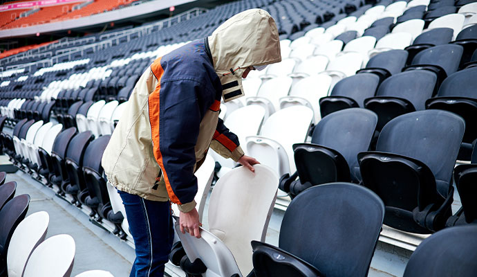 Pre-event arena stadium seating cleaning