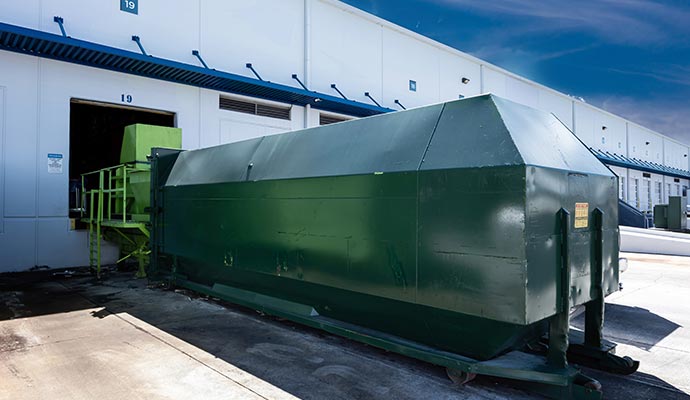 Stationary industrial waste compactor