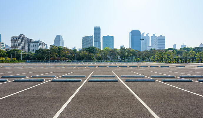 Parking lot cleaning using a professional sweeping machine