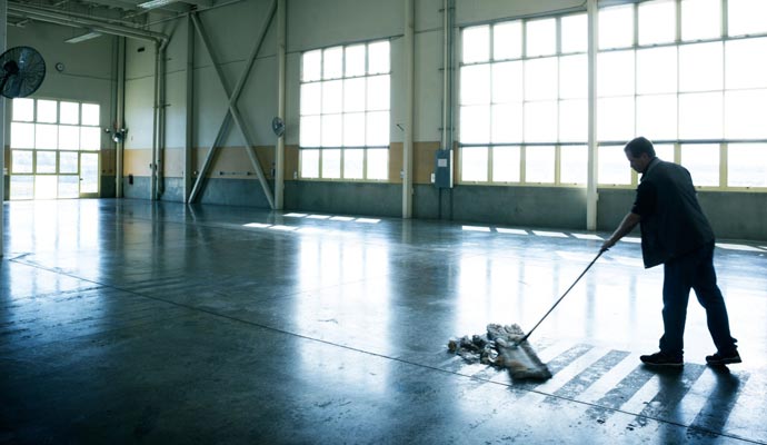 A cleaning cleaning a commercial space after construction work