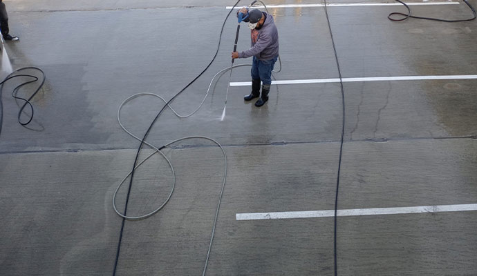 Professional parking lot cleaning using specialized cleaning equipment