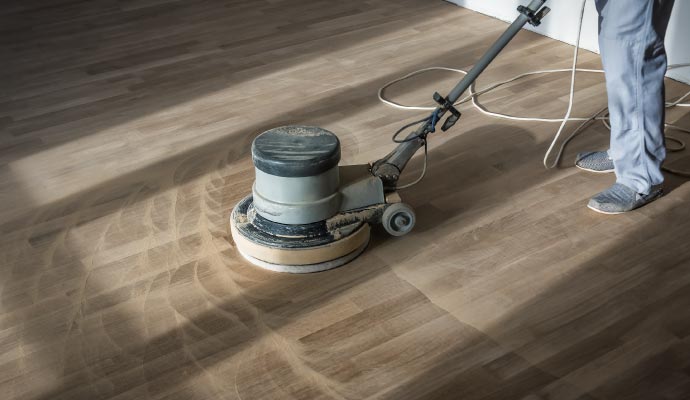 Wood floor cleanup with equipment